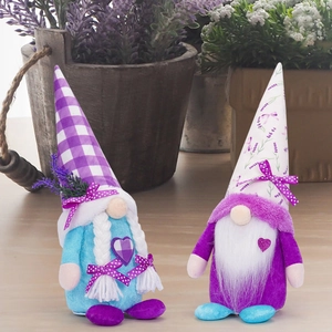Close-up of lavender gnomes set with purple floral hats and heart patterns for decoration