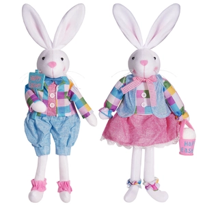 Pair of plush Easter bunnies with blue vest and pink lace skirt on white background