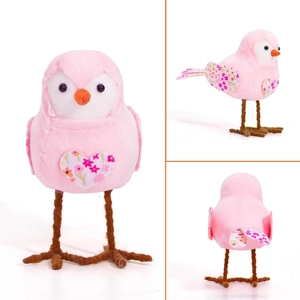 Detailed views of the plush pink Easter bird ornament with floral heart patches and wire legs