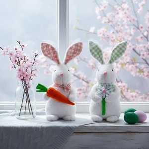 Standing Easter bunny plush dolls with carrot and daisy details in a festive window setting