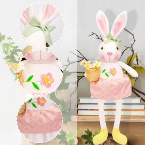 Detail of Easter bunny plush with lace dress, flower basket and embroidered floral motifs