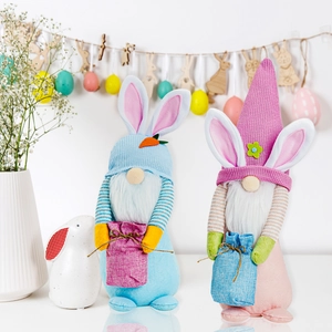 Pair of Easter gnomes with rabbit ears, knitted hats, and mini woven gift bags