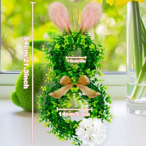Easter rabbit greenery wreath with pink burlap ears and a brown bow decoration