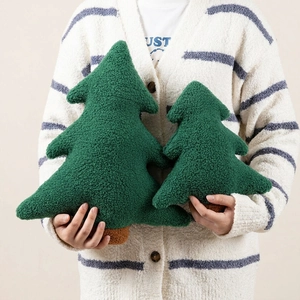Detailed close-up of textured teddy velvet Christmas tree pillows in two sizes