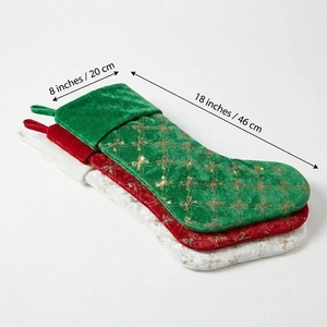 Three sequined Christmas stockings in red, green, and white with gold star embroidery