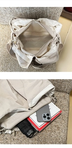 Spacious beige tote bag featuring multiple compartments with books and accessories inside