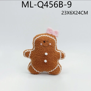 Gingerbread man plush pillow with pink bow and white embroidery for Christmas decor
