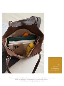 Spacious brown pebble leather tote bag interior showing ample storage for tablets and books