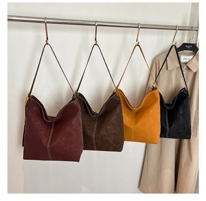 Detailed view of large tote bags in four colors with distinctive contrast white stitching