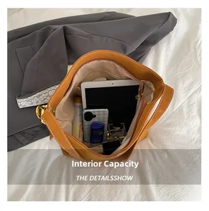 Detailed top view showing the spacious interior capacity of the caramel leather tote bag