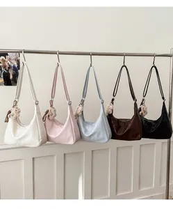 Hobo style handbags in five colors with cute teddy bear pendants on metal hooks