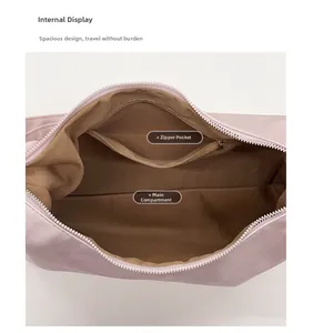 Detail view of the spacious inner compartment and secure zipper pocket in mauve tote bag