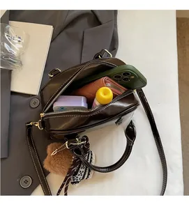 Top view of brown leather handbag interior showcasing spacious storage for daily essentials