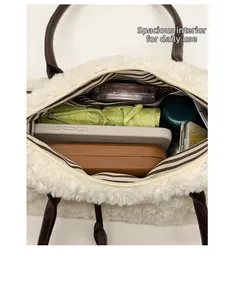 Detail view of large interior capacity and striped lining of this white plush tote bag