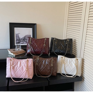 Collection of quilted shiny faux leather tote bags with elegant gold chain straps in five colors
