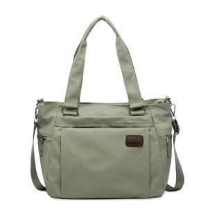 Green nylon tote bag with multiple zipper pockets and adjustable shoulder strap