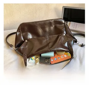 Detail showing the large interior capacity of this brown oil wax leather tote bag