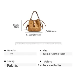 Detail of brown PU leather bucket bag with retro embossed logo and drawstring closure