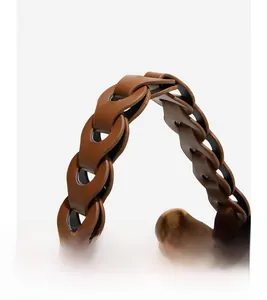 Detail of woven brown leather strap showing high-quality interlocking craftsmanship