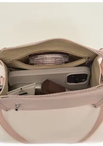 Internal view of light pink pebble leather bag showing spacious main pocket and inner zip pouch