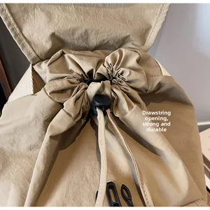 Detail of khakhi backpack showing durable drawstring closure and reinforced fabric texture