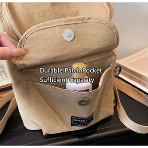 Close-up of khaki nylon backpack with magnetic pocket and durable fabric texture