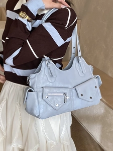 Light blue multi-pocket motorcycle tote bag with rivets and adjustable handle strap