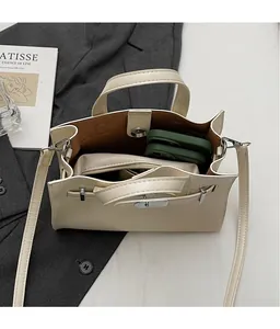 Interior view of beige crossbody bag showing large capacity with an organizer pouch