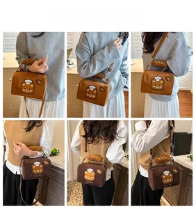 Detailed model views of a retro teddy bear embroidery crossbody bag with bread handle