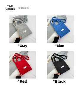 Detail view of mini wool crossbody bags in grey, blue, red, and black color options