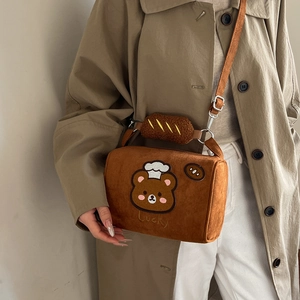 Caramel brown plush crossbody bag with bear embroidery and realistic bread decoration