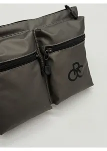 Detail view of water-resistant nylon shoulder bag with multiple zippered pockets