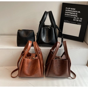Retro PU leather bucket bags in black and brown colors with a minimalist trapezoid design