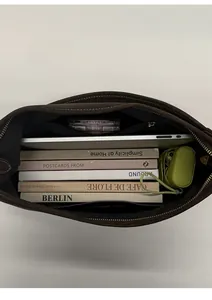 Spacious interior of the brown leather tote bag with zip pocket and daily essentials