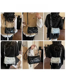 Detail shots of black and light blue rivet bucket bags with zippers and adjustable straps