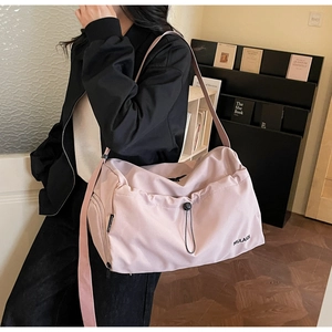 Macro detail of pink large-capacity travel bag with adjustable drawstring buckle