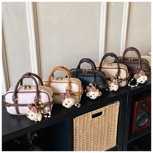 Five assorted colors of vintage mini Boston bags with cute teddy bear charms