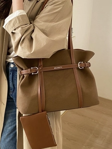 Large canvas tote bag with brown leather trim and matching small hanging pouch