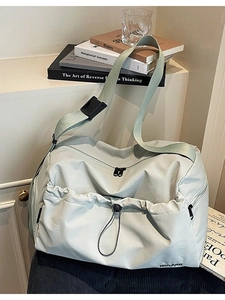 Large mint green travel bag with dry-wet separation and adjustable woven shoulder strap