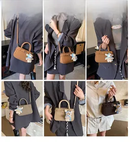 Detailed views of leather crossbody bags with bear charms and adjustable shoulder straps