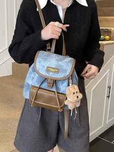 Blue denim and brown leather women's backpack with cute teddy bear charm and metal ring