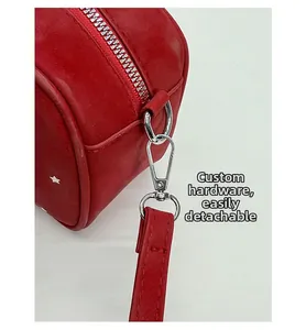 Detail of red star pattern bag with custom silver hardware and detachable strap