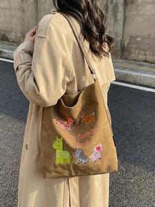 Brown suede tote bag with cartoon animal embroidery and leather shoulder strap