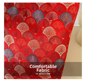 Macro shot of exquisite red and gold floral embroidery on high-quality fabric bag