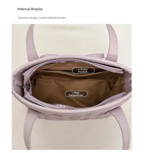 Top view detail of lavender tote bag interior with main compartment and inner pocket