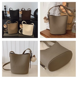 Detail of four vintage bucket bags in soft lychee grain texture with cute bear charms