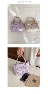 Detail of checkered bucket bags with cute bear prints, bows and heart metal pendants