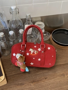 Red retro boston bag with star pattern and rocking horse embroidery on synthetic leather