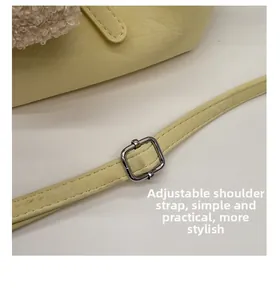 Close-up of adjustable PU leather shoulder strap with silver buckle and plush trim detail