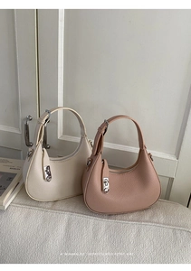 Minimalist crescent bags in off-white and dusty rose leather with silver metal buckles